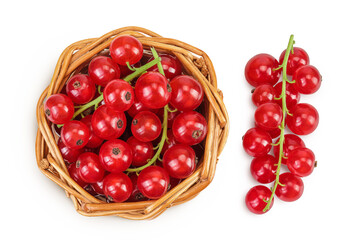 Red currant berries in a wicker basket with leaf isolated on white background. Top view. Flat lay
