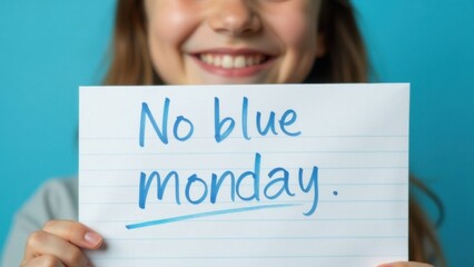 A cheerful young girl holds up a handwritten sign declaring no blue monday, conveying a message of optimism. Her bright smile enhances the uplifting sentiment of the moment