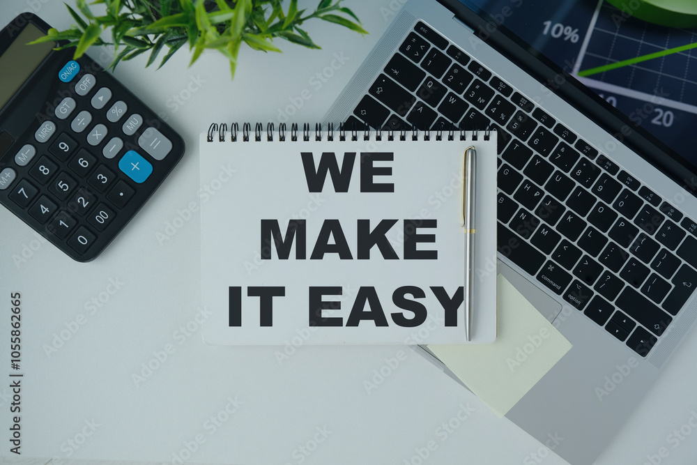 Poster we make it easy text in the notebook on a blue table. top view - business concept.