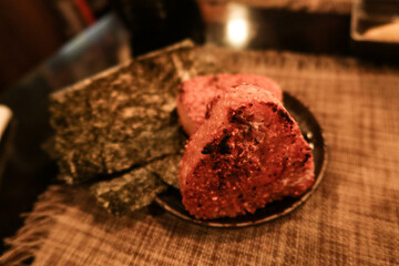 close up of Japanese grilled crispy rice onigiri rice ball with seaweed