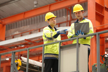 two professional engineer, worker, technician use clipboard discuss work, walk in steel metal...