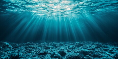 Naklejka premium An underwater scene, showcasing sunlight filtering through water onto a rocky seabed, creating a serene ambiance.