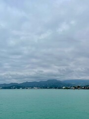 STORM CLOUDS OVER THE BLUE OCEAN