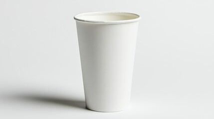 Single White Paper Cup on a White Surface