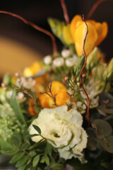 A beautiful bouquet of white and yellow freesia flowers, artfully arranged to capture the freshness and elegance of spring blooms. The gentle hues of white and vibrant yellow combine to create a charm