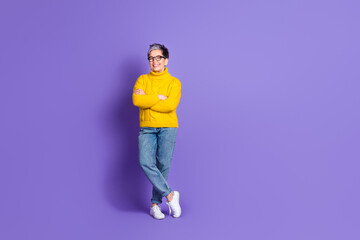 Full length photo of adorable funny woman yellow knitwear arms crossed empty space isolated violet color background