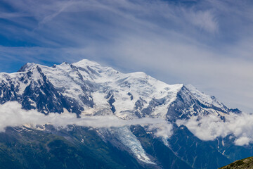 Mont Blanc, Monte Bianco mountain summit snow dome above the Chamonix valley in France. Highest peak in Europe in the Alps, alpice scenic view of Montblanc