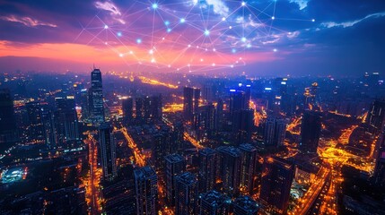 Fototapeta premium Aerial cityscape at night with digital network connections glowing in the sky