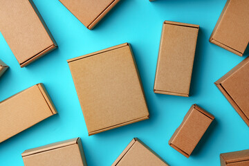 Fototapeta premium A collection of cardboard boxes arranged on a bright blue surface