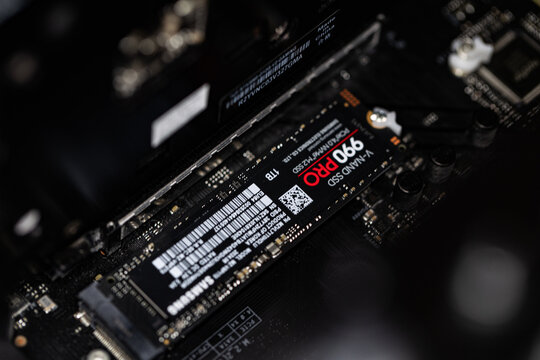 Samsung SSD 990 PRO PCle 4.0 NVMe M.2 on motherboard background