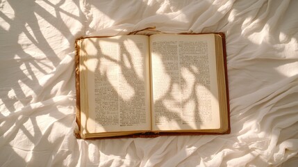 Open Book with Shadows on a Soft Surface