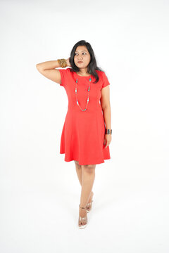 modal wearing one piece short dress in red color, fashion concept , full body image,isolated over white background.