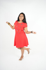 smiling young girl act holding shopping bags, happy face, full length portrait image, isolated over white background.