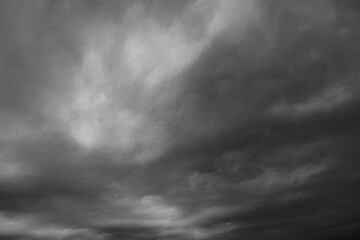 Dark and ominous storm clouds shift across the sky, capturing the power of nature's atmosphere.