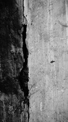 Ageing marks creating abstract image on an old wall, broken plaster aged with long time. Black and white image of ageing, portrayed on an old wall. Howrah, West Bengal, India.
