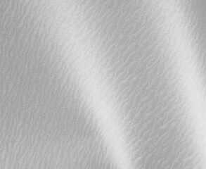 Glossy silver background with a smooth, wavy texture, evoking the elegance of stainless steel and