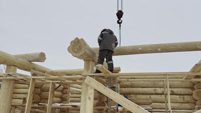 Construction of a house from solid logs. 