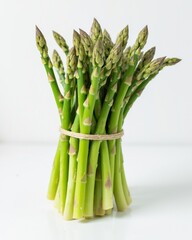 Close-up of a fresh asparagus bundle tied with twine, showcasing its vibrant green color and tender tips.
