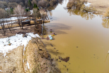 Spring flood of the river after winter, aerial view