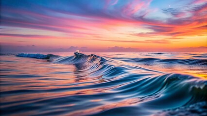 Fototapeta premium Tranquil Dawn Waves: Soft Grey and Pastel Pink Water Surface at Sunrise for Serene Night Photography