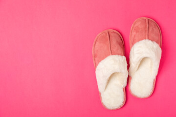 Soft slippers on a bright colored background, close-up. House slippers. Comfortable shoes for home....