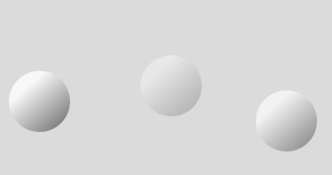 Multiple white spheres bouncing on solid gray background. gray volumetric balls on a gray
