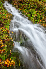 At the “Gönniger Seen“ lakes in Reutlingen, the Wiesaz creek plunges down a steep cascade that carries the water around a former quarry and is now a much-visited nature reserve. Long time exposure.