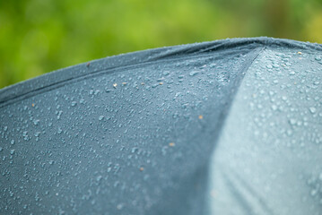 Top of tent in water drops. Camping on nature, rainy weather, waterproof tent in water