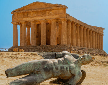 The statue of Icarus by Igor Mitoraj at the ancient greek temple in Akragas city near Agrigento in Sicily.  