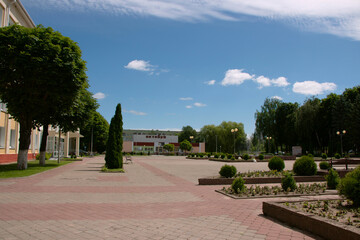 Fototapeta premium Central square in the city of Chechersk on a sunny summer day, Gomel region, Belarus