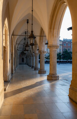 Arcade in Cloth Hall (Sukiennice) in Krakow, Poland durign golden hour