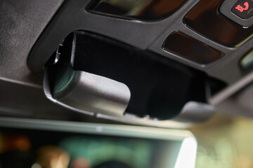 A detailed closeup view of a Car Interior Sunglasses Holder showcasing its sleek and modern design