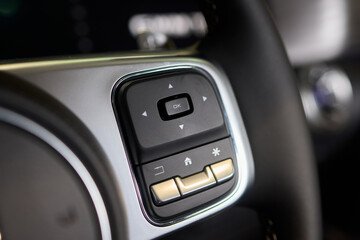 Naklejka premium The modern cars steering wheel control panel boosts convenience and performance