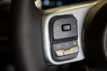 The modern cars steering wheel control panel boosts convenience and performance