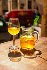 Enjoying refreshing sangria with fruits in sunny Lisbon, Portugal, where vibrant flavors and lively atmosphere create unforgettable moments