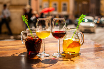 Enjoying refreshing sangria with fruits in sunny Lisbon, Portugal, where vibrant flavors and lively atmosphere create unforgettable moments