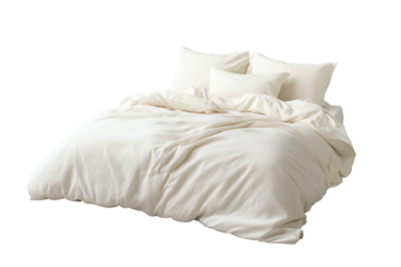 Elegant white bedding set with plush pillows on a soft white background.
