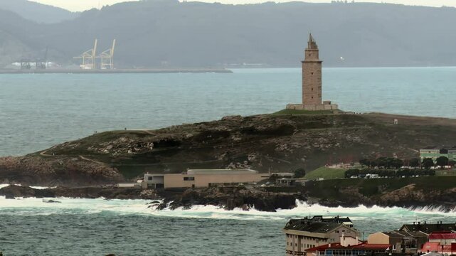 Tower of Hercules, lighthouse located in the Spanish city of A Coru&ntilde;a on a day with typical Galician weather with fog and rain