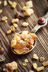 Frankincense or boswellia resin crystals on a spoon