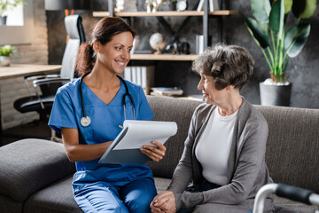 Smiling trustworthy medical worker nurse caretaker prescribing medications, pills, drugs,...