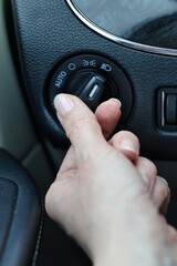 Low beam headlights - hand turning on the lights in the car