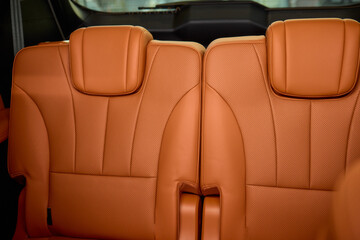 Indulge in Luxurious Orange Leather Car Seats that feature a Unique and Stylish Design