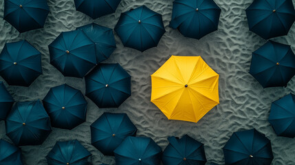 top view yellow umbrella among black umbrellas