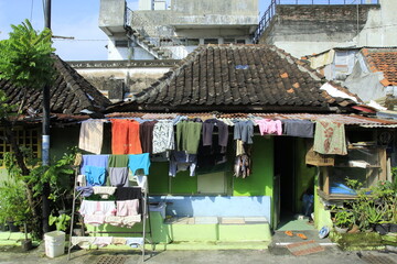 Residents use their roof tile to dry their clothes. Urban communities will use their limited space.