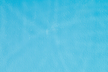 drops on water with circles on a blue background