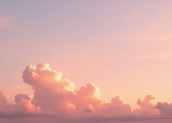 Fototapeta premium Soft pink clouds against a warm sunset sky create a serene natural landscape backdrop view.