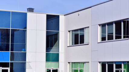 Abstract modern business architecture. Office building with  aluminum composite panels. Facade wall made of glass and metal. 