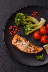Grilled salmon with salt and spices, broccoli, tomatoes, rice
