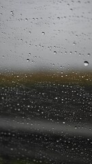 Morning dew drops on spider web against blurred green natural background. Macro photography of water droplets creating magical, ethereal pattern. Perfect for wellness, freshness, or environment