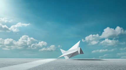 paper airplane on a clear blue sky background 